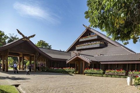 Ornate trees and lush flower gardens enhance the Lanna and Swiss architecture of the Doi Tung Royal