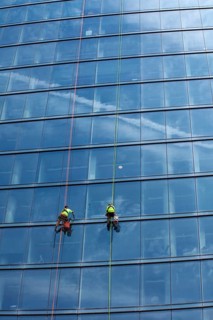 Detroit, Michigan - Window washers at the 25-story Residences Water Square luxury apartment