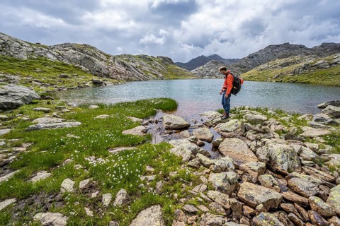 Mountaineer at a mountain lake in high mountain landscape at the Upper Senner Egete, Seven Lakes