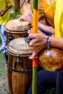 Meeting of Brazilian musicians playing their berimbaus and atabaques outdoors, Minas Gerais, Brazil
