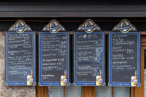 Food offers written on blackboards in front of a restaurant, Bavaria, Germany