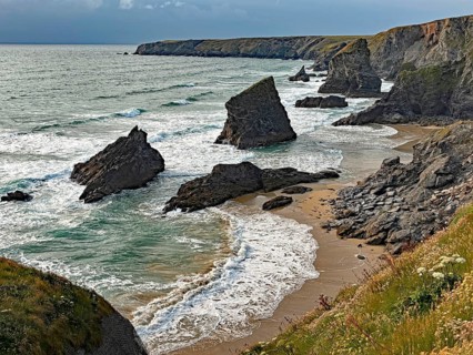 Dramatic coastal landscape with rocks and waves on the beach, Bedruthan Steps, Newquay, Cornwall,