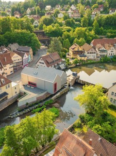 Town view with river and green nature, surrounded by half-timbered houses and trees, Calw, Black