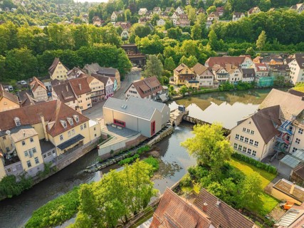 Idyllic town with river in front of a wooded hill with half-timbered architecture, Calw, Black