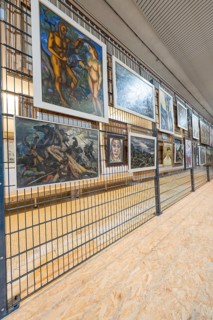 Gallery wall with various paintings in a modern art gallery ambience, historical art exhibition in