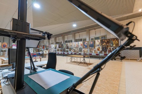 Working area in a gallery with view of exhibited works of art, historical art exhibition in the old