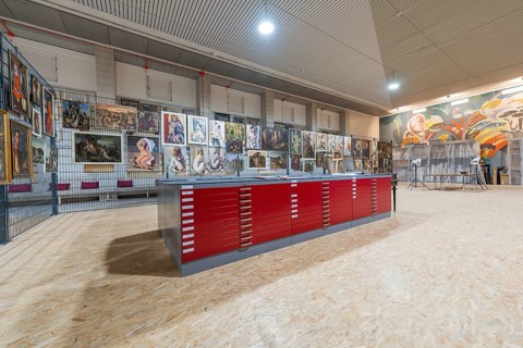 Gallery exhibition with red cabinets and paintings on the wall, historical art exhibition in the