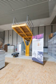 Industrial steel construction with railings and information poster, historical art exhibition in