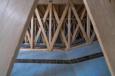 Wooden construction with geometric pattern and blue and white tiles, historical art exhibition in