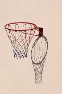 Basketball hoop with shadow cast on a white wall