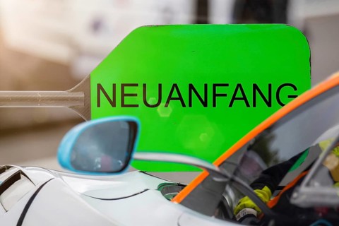 (Photomontage) New beginning Symbol image: Lollipop in motorsport with changed text NEW BEGINNING