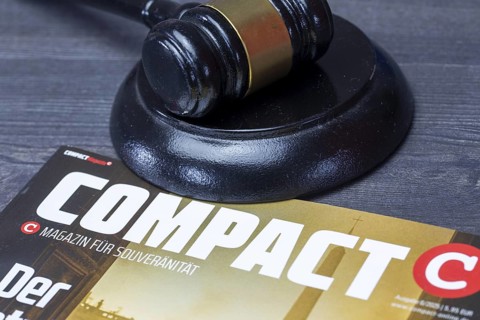 COMPACT MAGAZINE with a judge's gavel. A ban is being negotiated at the Federal Administrative