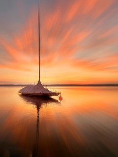 Evening mood, sailing boat on Lake Starnberg, zoom effect, Bavaria, Germany