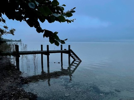 Shore area with jetty on Lake Starnberg, thunderstorm atmosphere, Bavaria, Germany