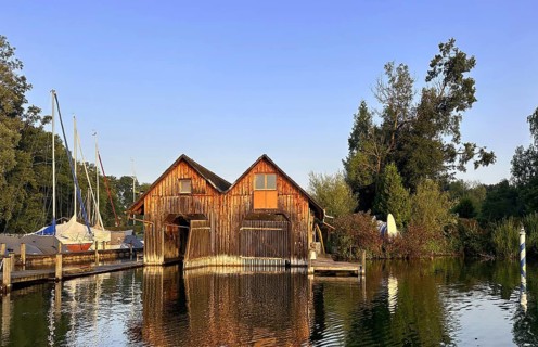 Boathouses on Lake Starnberg in the evening, Bavaria, Germany