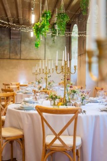 Festively decorated wedding tables with candle holders and floral decorations, event and wedding