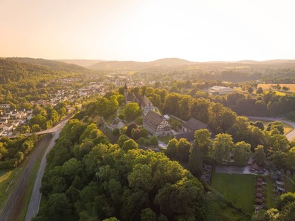 Sweeping views of a village and landscape at sunset, event and wedding location Lorch Monastery,