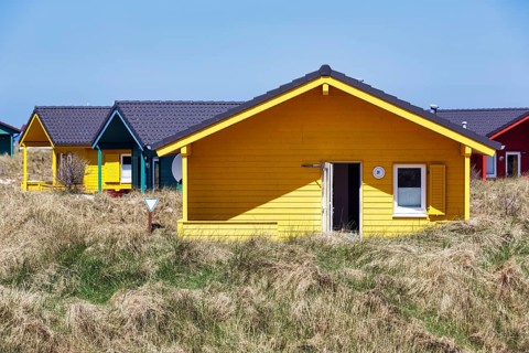 Colourful bungalows, holiday homes, wooden houses, blue sky, dune grass, dune, offshore island of