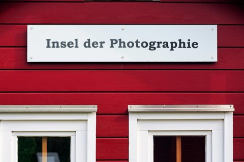 Red lobster shack, sign with inscription, Insel der Photographie, facade detail, Museum Helgoland,