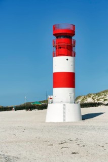 Red and white lighthouse Helgoland dune on the south beach, Helgoland dune, Helgoland island, North