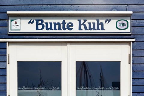 Blue lobster shack, wooden façade with window, rustic fish restaurant, façade detail in the