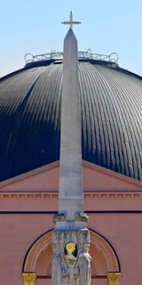 Alice monument, also known as Alice obelisk, in front of the dome of St Ludwig's, the main Catholic