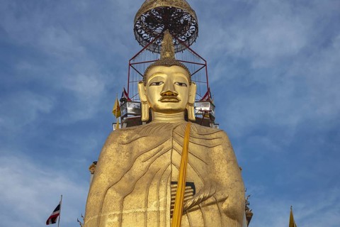 32 metre high standing Buddha decorated with glass mosaics and 24 carat gold, the upper knot of the