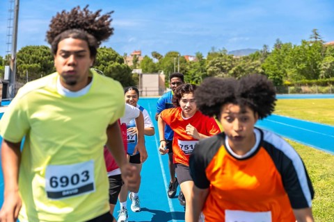 Diverse athletes competing fiercely on a vibrant blue track, pushing their limits and striving for