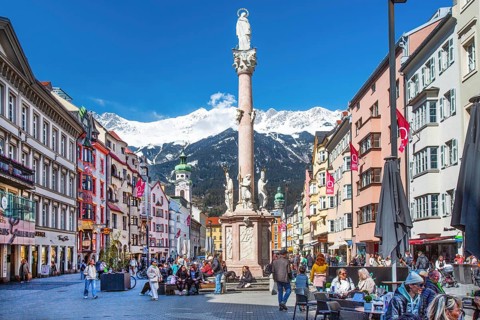 Pedestrian zone Maria-Theresien-Strasse with the Annasäule in front of the Nordkette of the