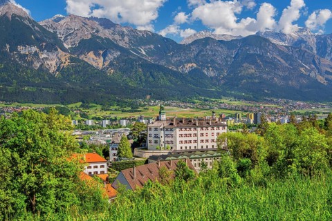 Ambras Castle on the outskirts of the city in front of the northern range of the Karwendel