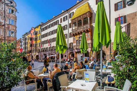 Street café on Herzog-Friedrich-Strasse in the historic city centre with the Golden Roof,