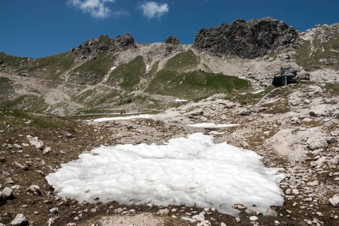 Remnant of snow and view of the Hintersteiner via ferrata, Nebelhorn, Oberstdorf, Allgäu Alps,