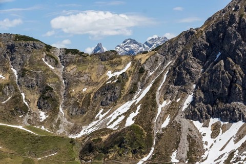 Dramatic rocky landscape with snow-capped peaks in Kleinwalsertal, Austria