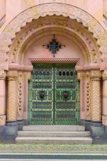 Entrance to the Archbishop's Ordinariate of Freiburg, historic ornate door under a decorative round