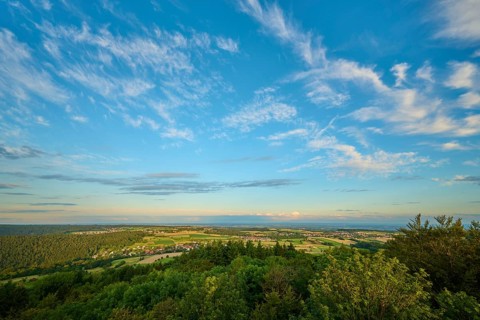 Panoramic view of a wide, green landscape under a blue sky, Katzenbuckel, Waldbrunn,