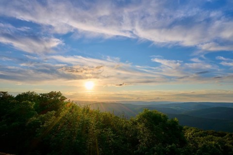 Sunset over wooded landscape with picturesque clouds, Katzenbuckel, Waldbrunn,