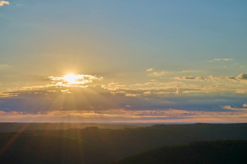 Sunrise over a calm landscape with clouds and rays of light, Katzenbuckel, Waldbrunn,