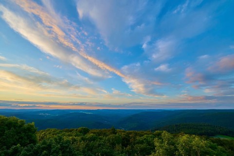 Pink and blue clouds over a tree landscape, sunset, Katzenbuckel, Waldbrunn, Neckar-Odenwald-Kreis,