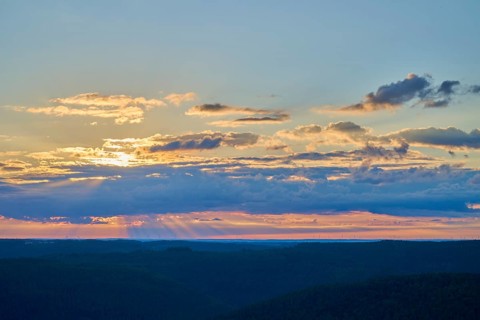 Morning sky with coloured clouds and rays of light over the landscape, Katzenbuckel, Waldbrunn,