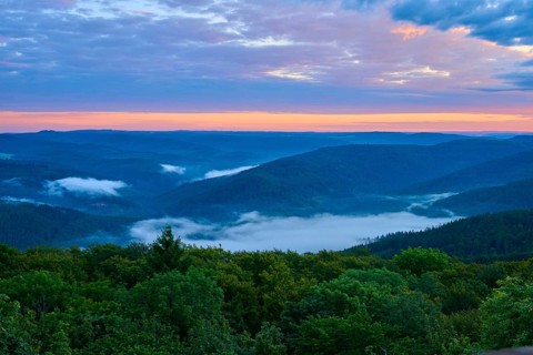 Hilly landscape at dusk, fog in the valleys, orange-blue sky, Katzenbuckel, Waldbrunn,