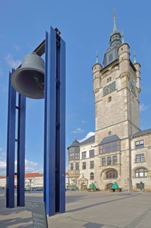 Town hall built in 1901 and peace bell created in 2000 as a monument and symbol of political