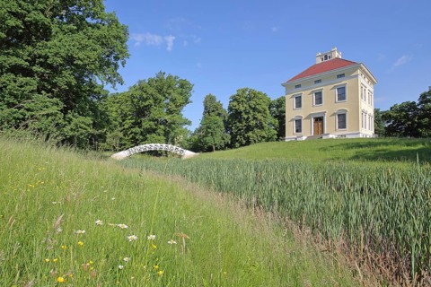 UNESCO Luisium, classicist palace with arched bridge, pond, reeds, idyll, Dessau-Wörlitz Garden