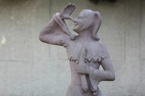 Sculpture of Till Eulenspiegel with gesture, thumb on nose, arm, high, up, hand, Bernburg,