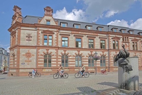 Historic post office and post office fountain with sculpture symbolising the Silent Post, fountain,