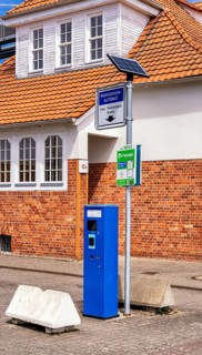 Blue parking ticket machine in the town harbour of Sassnitz, Rügen, Mecklenburg-Vorpommern, Germany