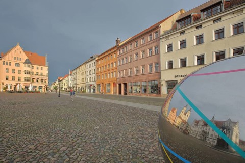 Historic houses with mood lighting on the market square, metal sphere with reflection, Cranachhof,