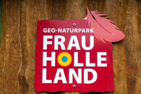 Information board with feather, GEO nature park Park Frau Holle Land am Meissner, low mountain