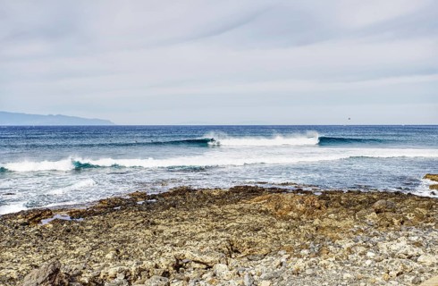 View over a rocky coast to calm broken waves, Tenerife, Canary Islands
