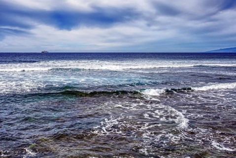 Waves breaking in the sea under a cloudy sky, Tenerife, Canary Islands