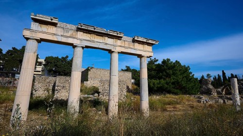 Ruins of an ancient temple with columns in a natural setting, Archaeological site, Xysto Columned